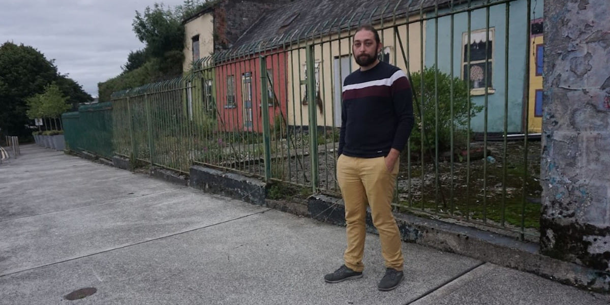 Ruairí Fahy, People Before Profit representative for Limerick City North, stands outside the Toll Cottages on Verdant place, that have recently been marked for Sale by Limerick Council.