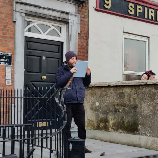 People stop to hear from Cian Prendiville about alternatives to the proposed office focused development on the Opera site during the Anti-Dereliction protest in Feburary.